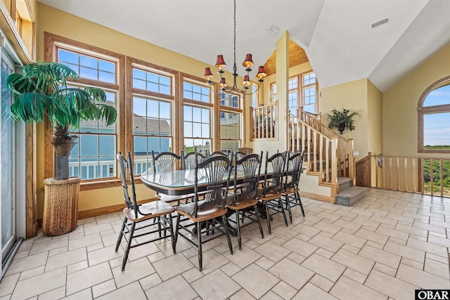 369 Deep Neck Rd Lot # 139, Corolla, NC 27927 - dining space featuring a chandelier, stairway, lofted ceiling, and wainscoting