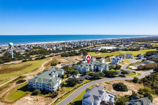 birds eye view of property featuring a water view and a residential view