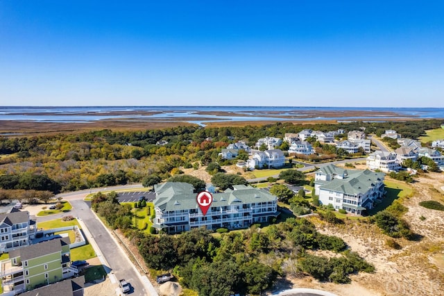 bird's eye view with a residential view and a water view