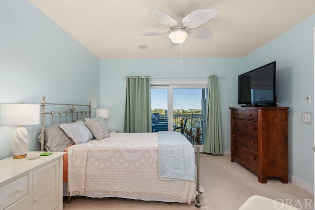 bedroom with light carpet, access to exterior, baseboards, and a ceiling fan