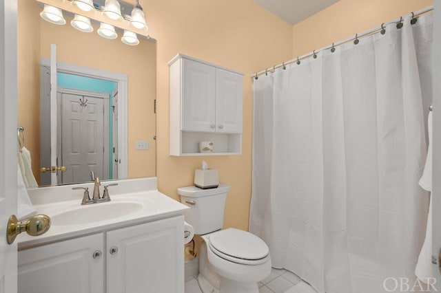 full bathroom with vanity, toilet, and tile patterned floors