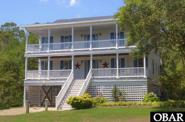106 Flight Dr Lot 4, Duck, NC 27949 - view of front facade with a porch, stairs, and a balcony