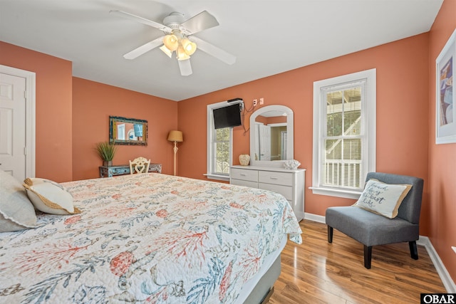 106 Flight Dr Lot 4, Duck, NC 27949 - bedroom with light wood finished floors and ceiling fan