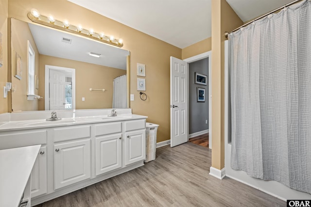 106 Flight Dr Lot 4, Duck, NC 27949 - bathroom with double vanity and wood finished floors