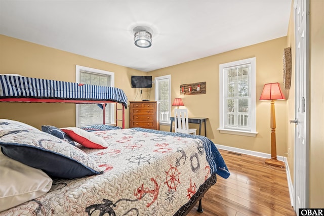 106 Flight Dr Lot 4, Duck, NC 27949 - bedroom with baseboards and wood finished floors