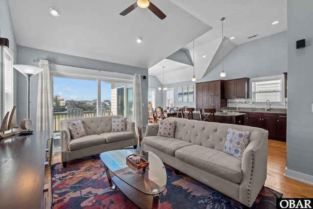5309 S Sand Wedge Ln Lot 5, Nags Head, NC 27959 - living area featuring light wood-style floors, ceiling fan, recessed lighting, a chandelier, and high vaulted ceiling