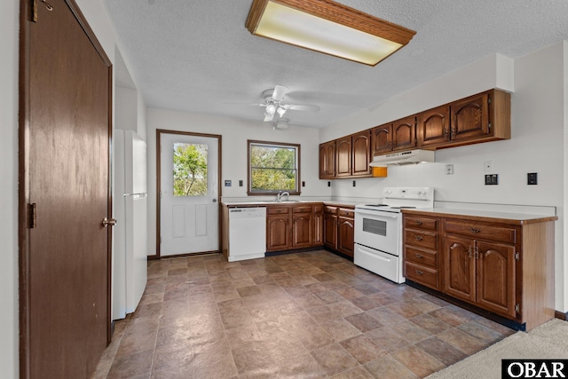 116 W Old Cove Rd Lot 1, Nags Head, NC 27959 - kitchen featuring white appliances, a textured ceiling, under cabinet range hood, light countertops, and a ceiling fan
