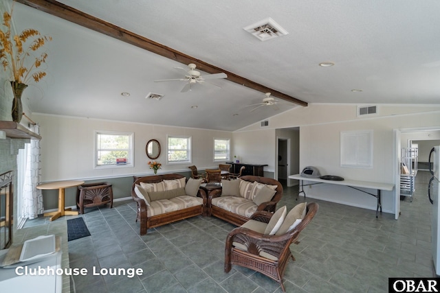 116 W Old Cove Rd Lot 1, Nags Head, NC 27959 - living room with baseboards, a fireplace, visible vents, and vaulted ceiling with beams