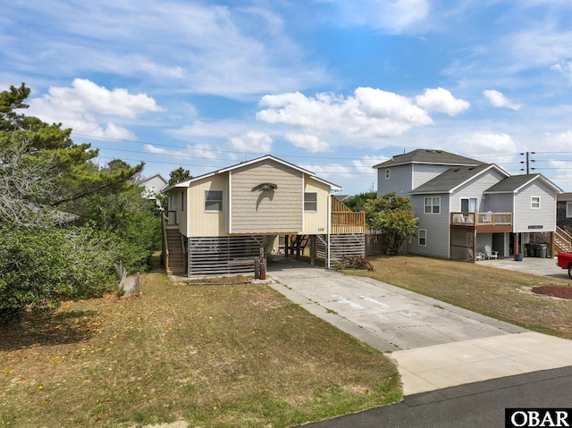 116 W Old Cove Rd Lot 1, Nags Head, NC 27959 - view of front of house featuring stairway, a front yard, and driveway