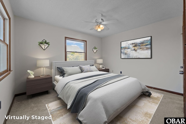 116 W Old Cove Rd Lot 1, Nags Head, NC 27959 - bedroom with a textured ceiling, light carpet, baseboards, and a ceiling fan