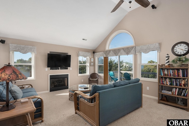 living area featuring plenty of natural light and light colored carpet