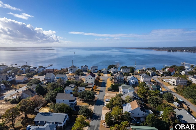 bird's eye view featuring a residential view and a water view