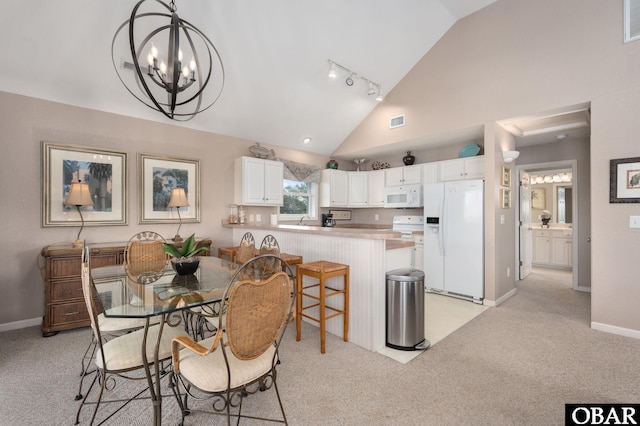 dining room featuring a notable chandelier, high vaulted ceiling, baseboards, visible vents, and light carpet
