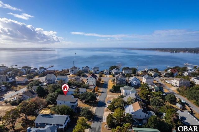 birds eye view of property with a residential view and a water view