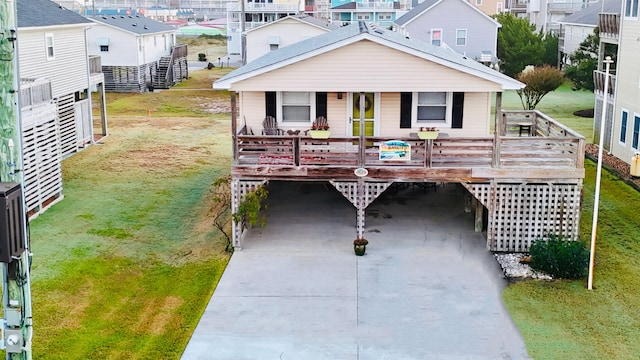 view of front of house featuring driveway, a front lawn, and a porch