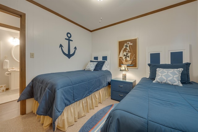 bedroom with ornamental molding, vaulted ceiling, and ensuite bath
