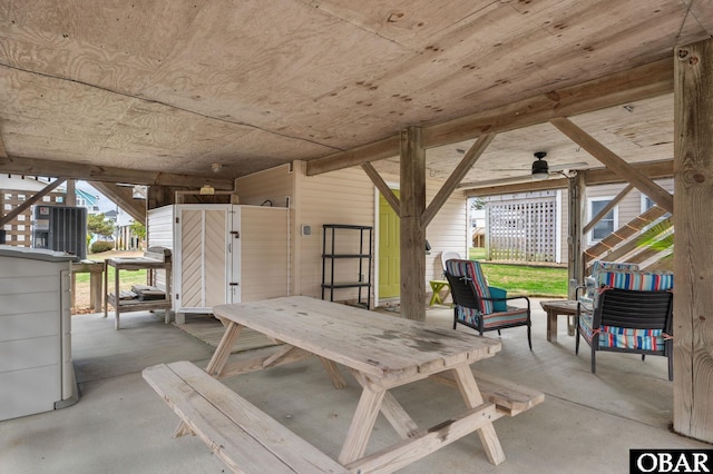 view of patio / terrace with ceiling fan and stairway
