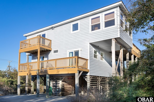 back of property featuring stairs