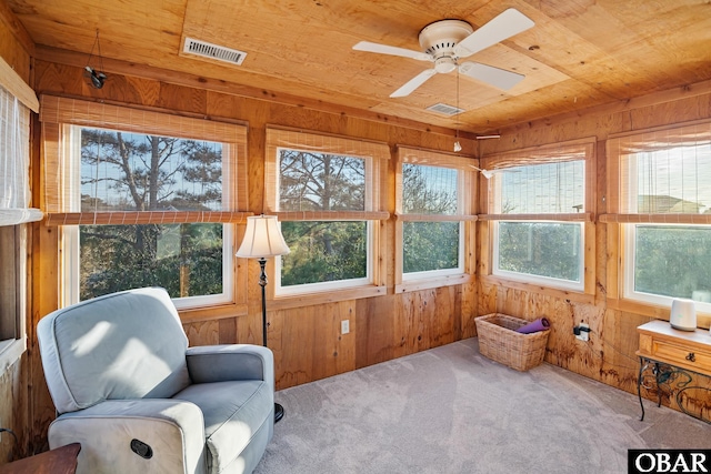 sunroom / solarium featuring wood ceiling, visible vents, and ceiling fan