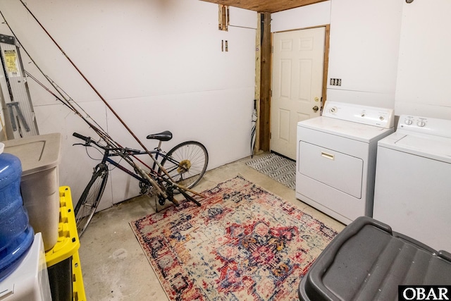 clothes washing area with laundry area and washer and clothes dryer