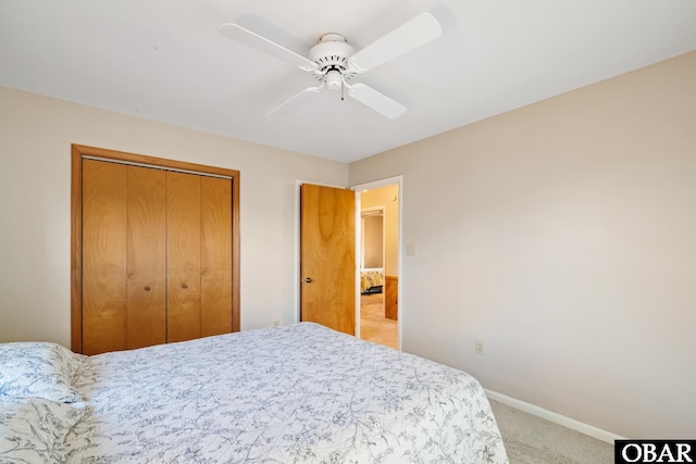 bedroom with a closet, carpet flooring, a ceiling fan, and baseboards