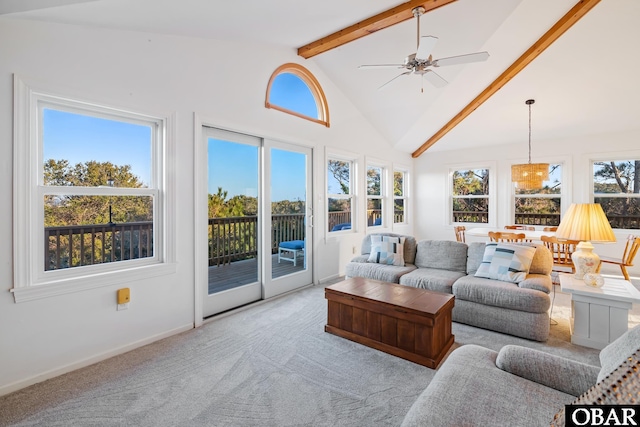 sunroom with vaulted ceiling with beams and ceiling fan