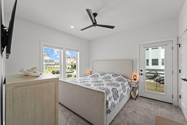 carpeted bedroom with a ceiling fan and recessed lighting