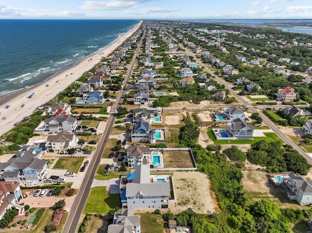 aerial view with a beach view and a water view