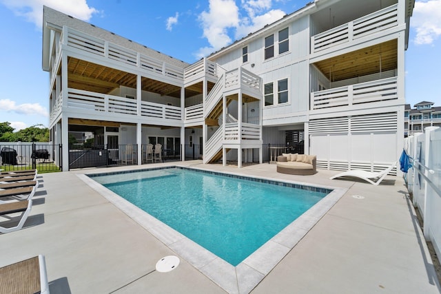 view of pool featuring a patio, fence, and a fenced in pool