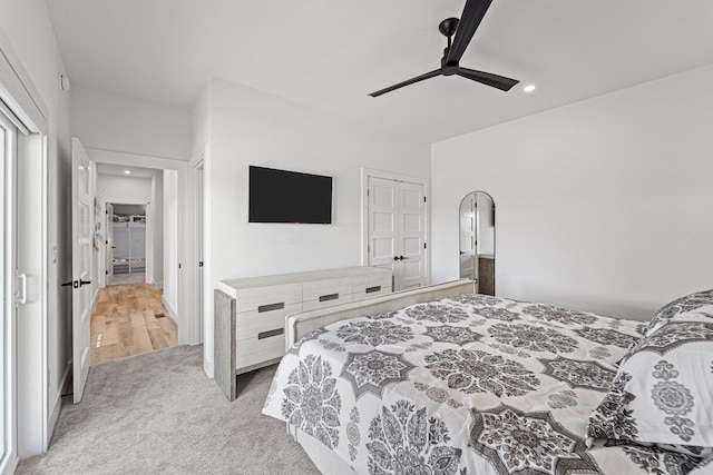 carpeted bedroom with ceiling fan