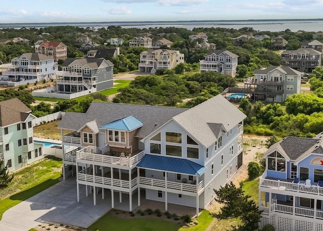 birds eye view of property featuring a residential view and a water view