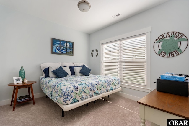 bedroom featuring carpet, visible vents, and baseboards