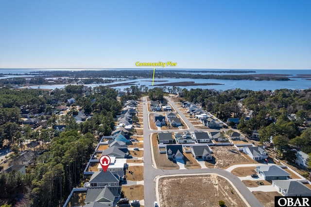 aerial view featuring a residential view and a water view