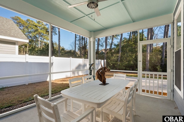 sunroom / solarium featuring ceiling fan