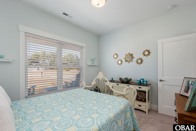 carpeted bedroom with visible vents