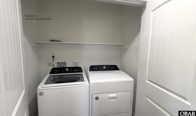 clothes washing area with laundry area and washer and dryer