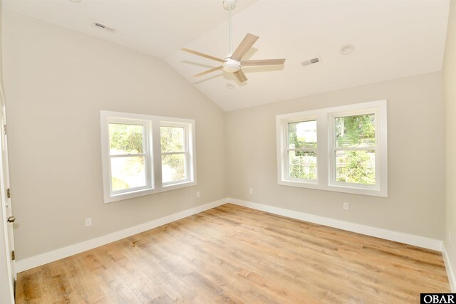 112 Mybet Ct Lot 100, Kill Devil Hills, NC 27948 - empty room featuring a ceiling fan, vaulted ceiling, wood finished floors, and baseboards