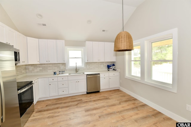 112 Mybet Ct Lot 100, Kill Devil Hills, NC 27948 - kitchen with appliances with stainless steel finishes, a sink, tasteful backsplash, white cabinets, and high vaulted ceiling