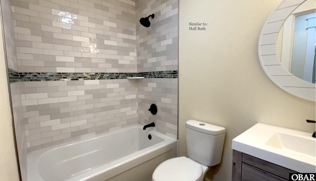 bathroom featuring bathing tub / shower combination, toilet, and vanity