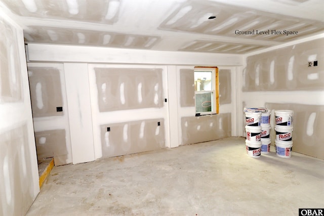 interior space featuring unfinished concrete floors