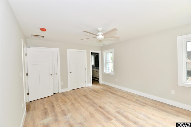 112 Mybet Ct Lot 100, Kill Devil Hills, NC 27948 - unfurnished bedroom with light wood finished floors, two closets, and baseboards