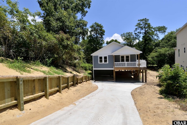 112 Mybet Ct Lot 100, Kill Devil Hills, NC 27948 - coastal inspired home with concrete driveway and a carport