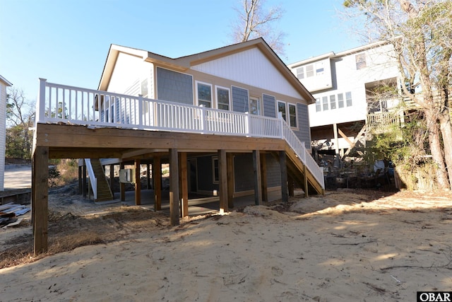 back of house with stairs and a wooden deck