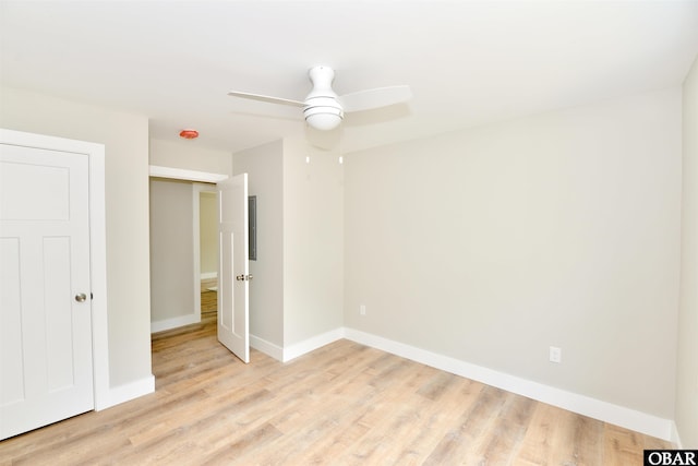 112 Mybet Ct Lot 100, Kill Devil Hills, NC 27948 - unfurnished bedroom with baseboards, light wood-style floors, electric panel, and a ceiling fan