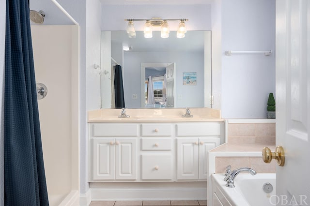 full bath with a stall shower, double vanity, a sink, and a bath