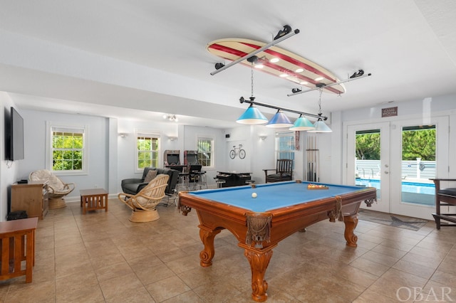 rec room featuring billiards, light tile patterned flooring, and french doors