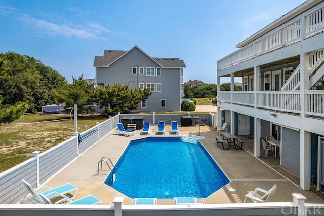 view of swimming pool with a fenced in pool, a patio, and fence