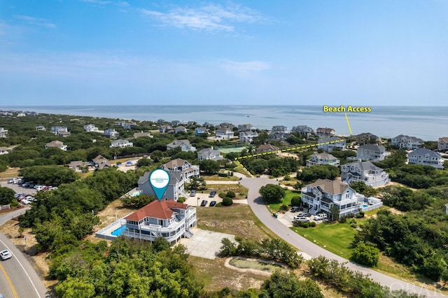 drone / aerial view featuring a water view and a residential view