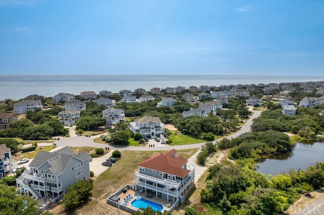 aerial view featuring a water view and a residential view