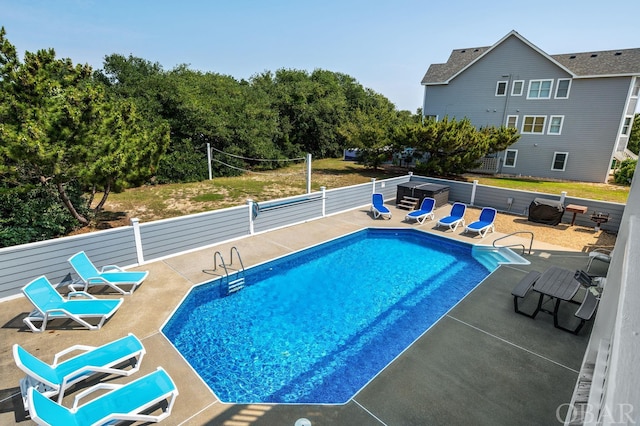 view of pool featuring a fenced in pool and a patio area